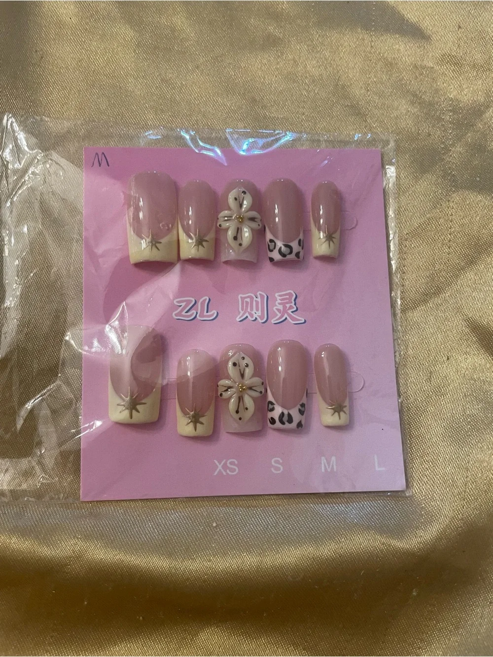 Nude Pink Press-On Nail Set with Cream Tips and Accent Designs